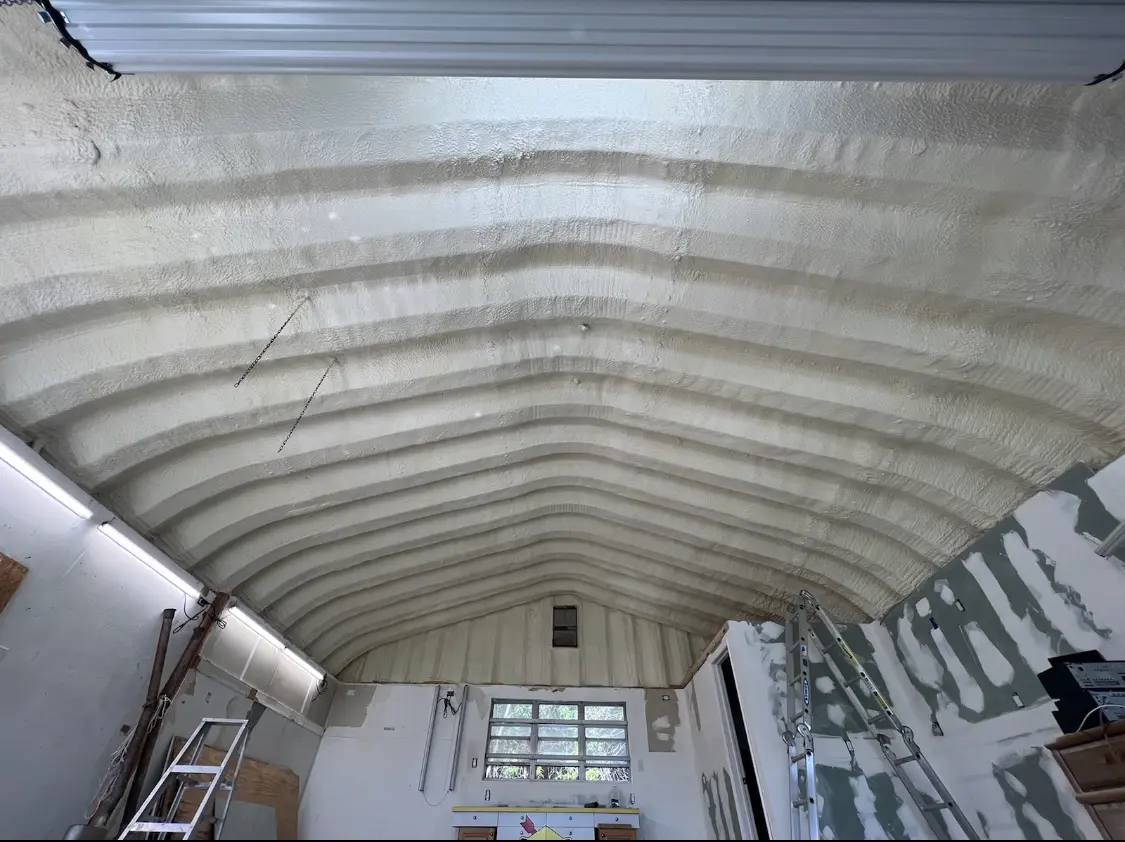 Spray polyurethane foam applied to the underside of a metal roof deck in Scenic Oaks